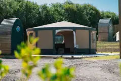 Yurt exterior with outdoor picnic table and BBQ Yurt exterior with outdoor picnic table and BBQ