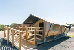 Family safari tent with ramp access and a decking area