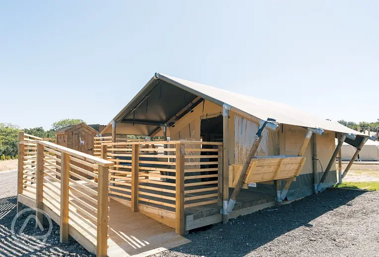 Family safari tent with ramp access and a decking area