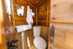 Private compost toilet hut with a hand washing sink Private compost toilet hut with a hand washing sink