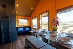 Safari lodge living and dining area with a sofa