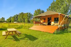 Safari lodge with a decking and picnic bench Safari lodge with a decking and picnic bench