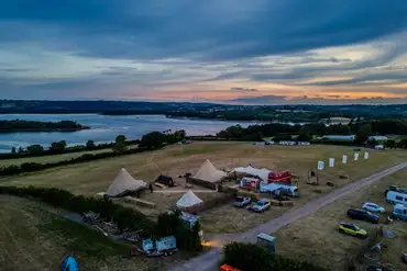 Aerial of Nesta Valley Camping at sunset with views of Chew Valley Lake