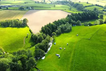 Aerial of Puddlemire campsite with a stream running through the site
