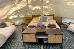 Alders Edge bell tent with a double bed and two camp beds (bedding included)