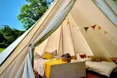 Alders Edge bell tent with a double bed and two camp beds (bedding included)