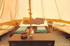 Alders Edge bell tent with a double bed and two camp beds (bedding included)