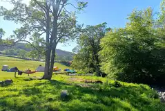 By the Beck non electric grass pitches with waterside views By the Beck non electric grass pitches with waterside views