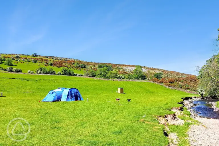 By the Beck non electric grass pitches with private toilets nearby