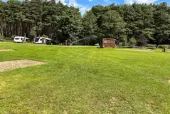 Electric hardstanding pitches (3m x 9m) next to the facility block