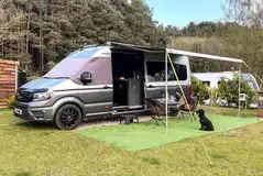 Campervan and awning on the electric hardstanding pitches