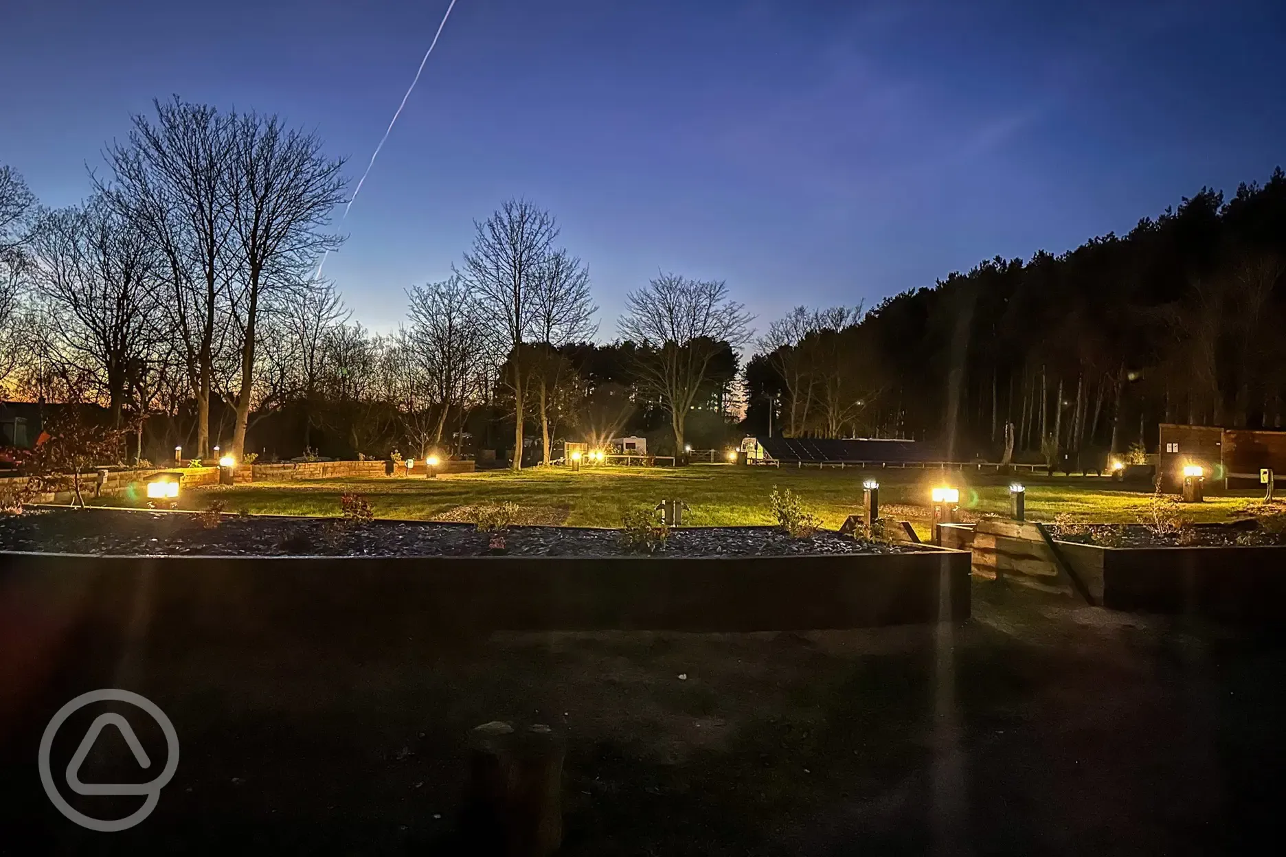 Electric hardstanding touring pitches at night