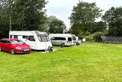 Electric hardstanding pitches (3m x 9m) with space for a parked car