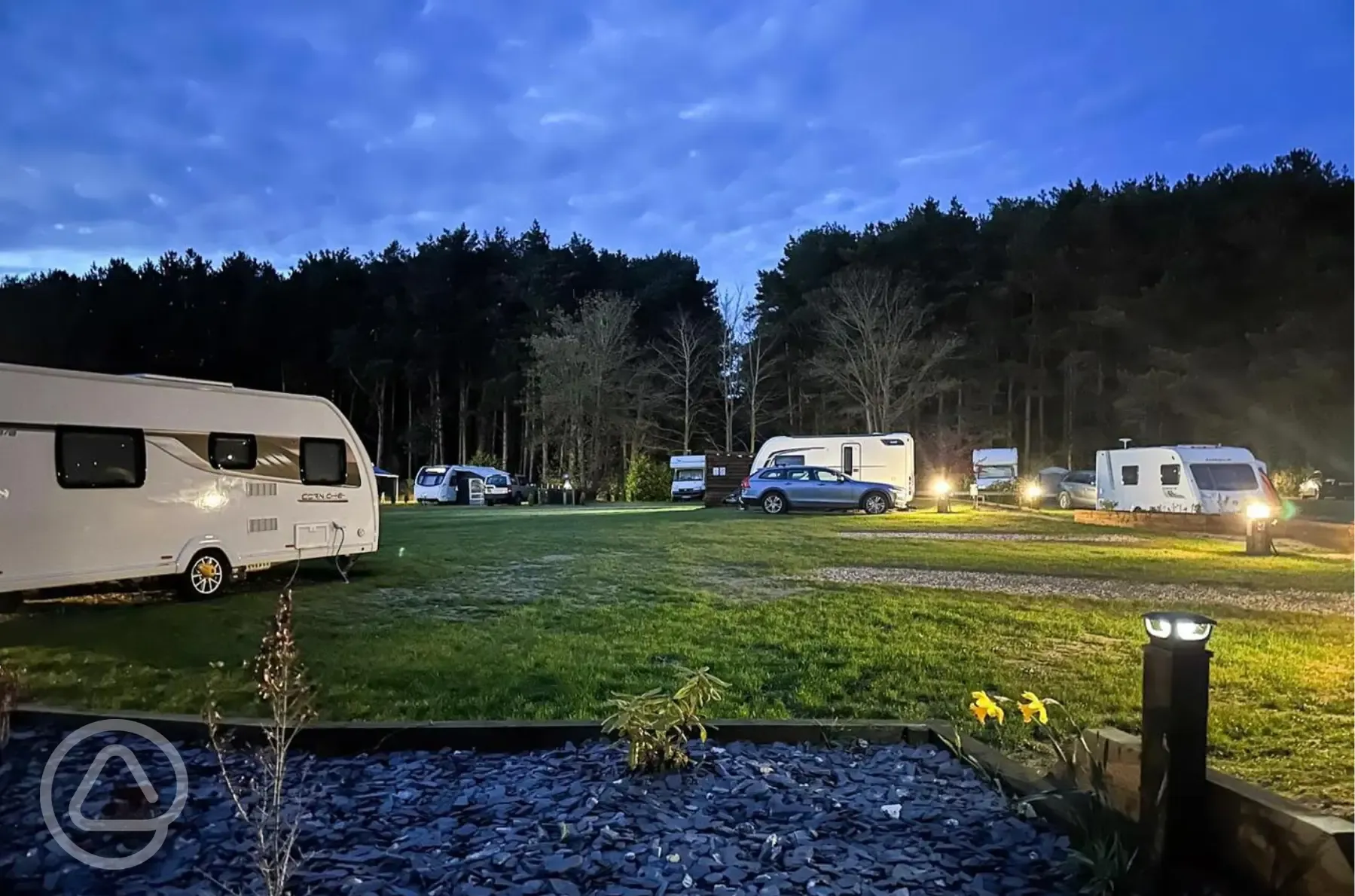 Electric hardstanding touring pitches at night