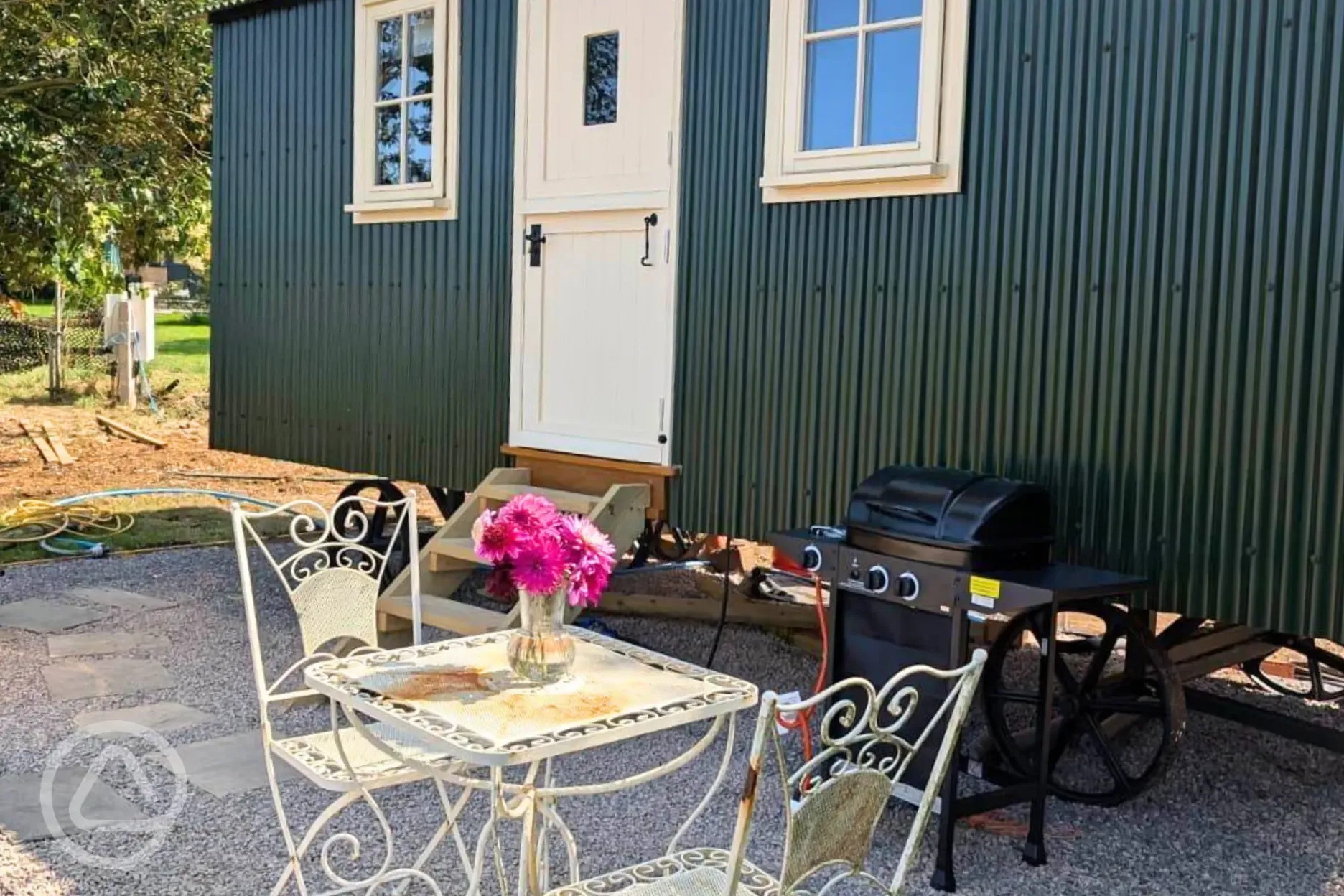 Skyland shepherd's hut with outdoor seating and a BBQ