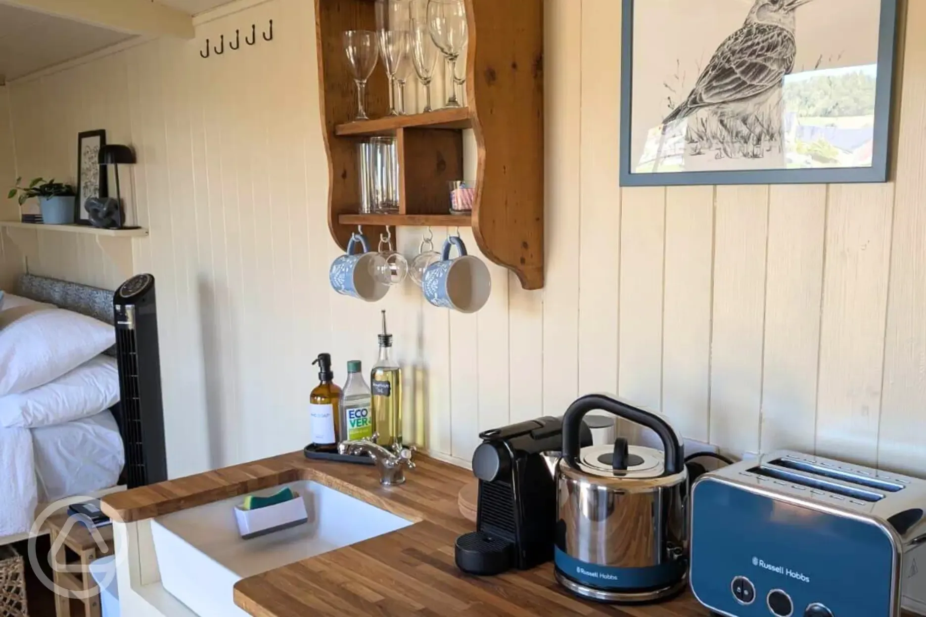 Skyland kitchen with a fridge, hob, kettle, sink, toaster and coffee machine