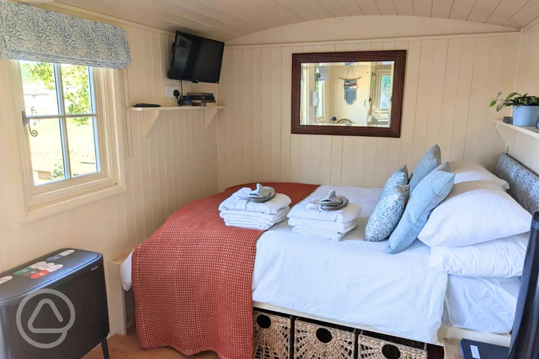 Skyland shepherd's hut double bed with an EMMA mattress and bedding
