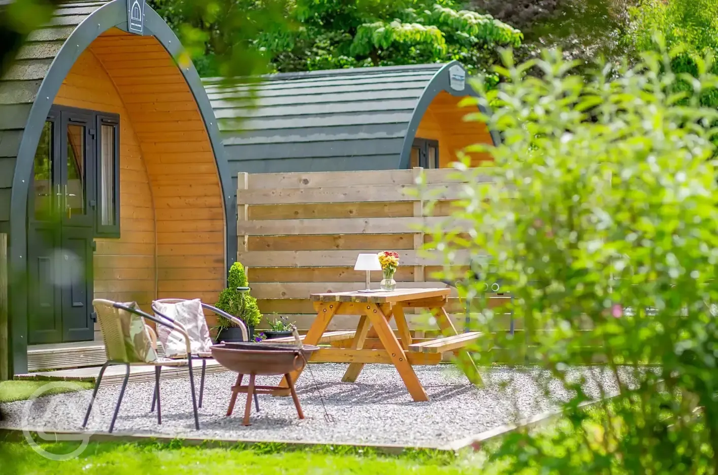 Glamping pods with private patios, fire pits and wood-fired hot tubs