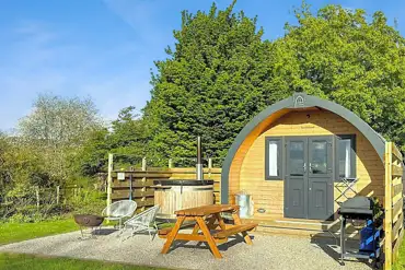 Hunts Court Huts glamping pods with wood-fired hot tubs