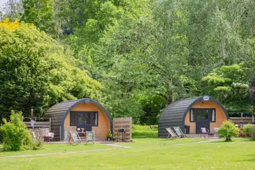 Hunts Court Huts glamping pods with wood-fired hot tubs