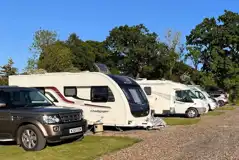 Electric grass and gravel touring pitches Electric grass and gravel touring pitches