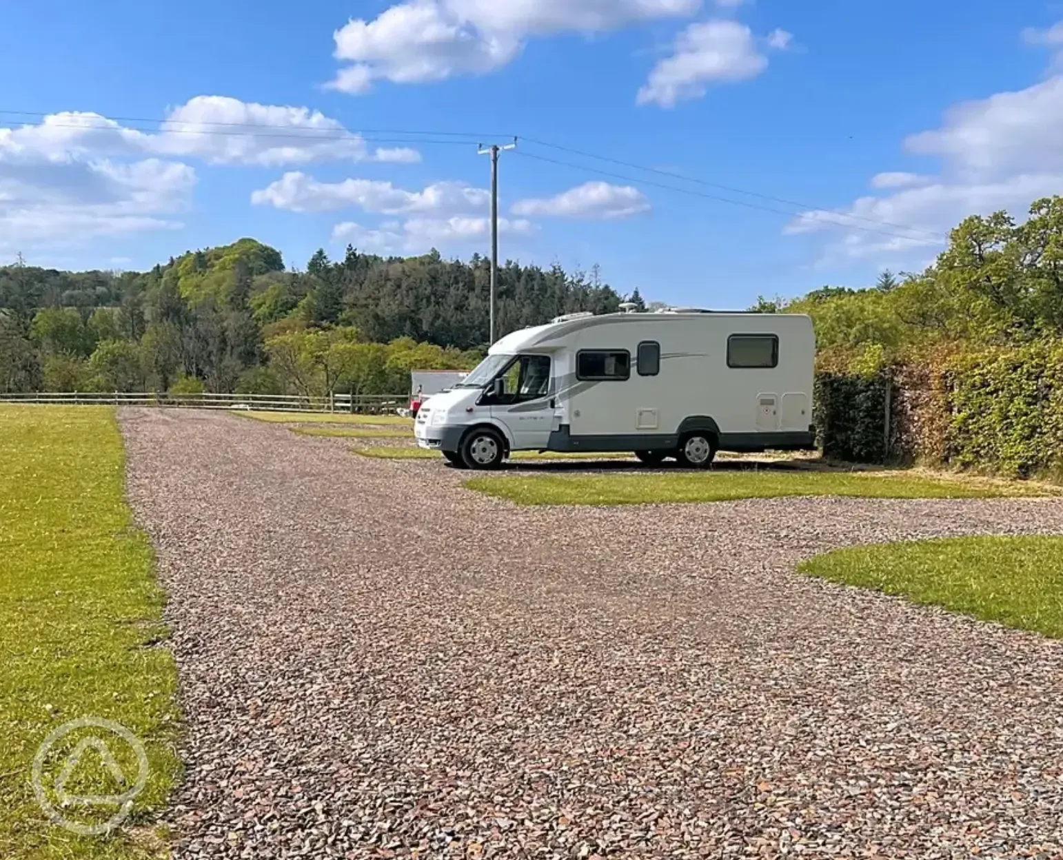 Electric grass and gravel touring pitches