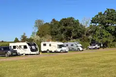 Electric grass and gravel touring pitches at Old Park Cottage Camping