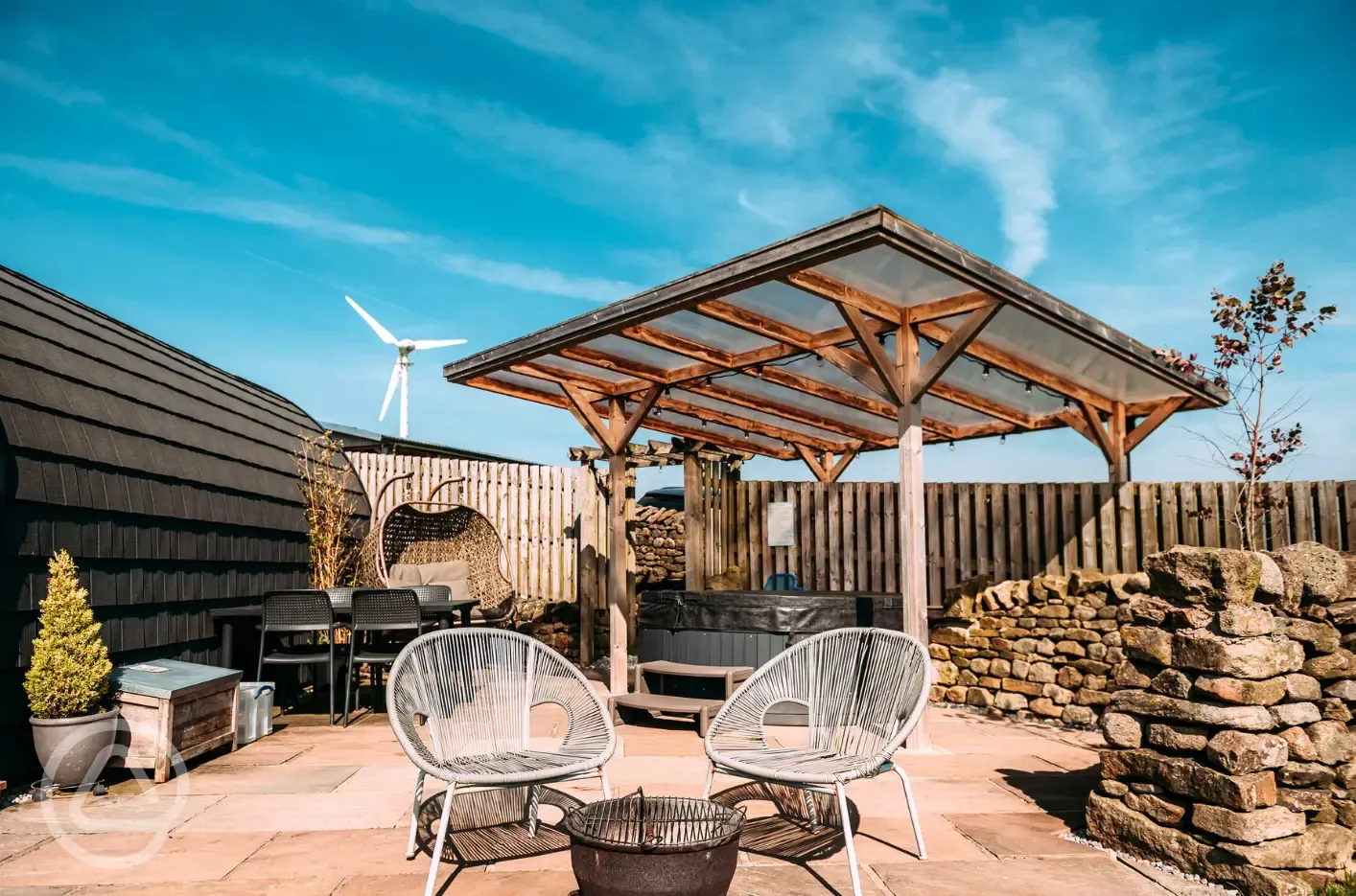 Private patios with hot tubs and cocoon swing chairs
