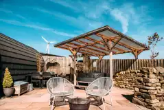 Private patios with hot tubs and cocoon swing chairs