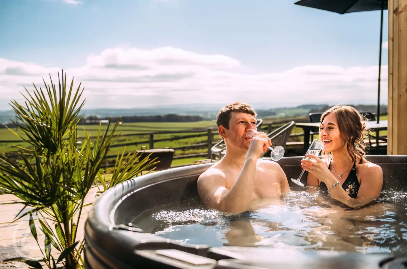 Private patios with hot tubs and cocoon swing chairs