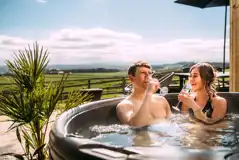 Private patios with hot tubs and cocoon swing chairs