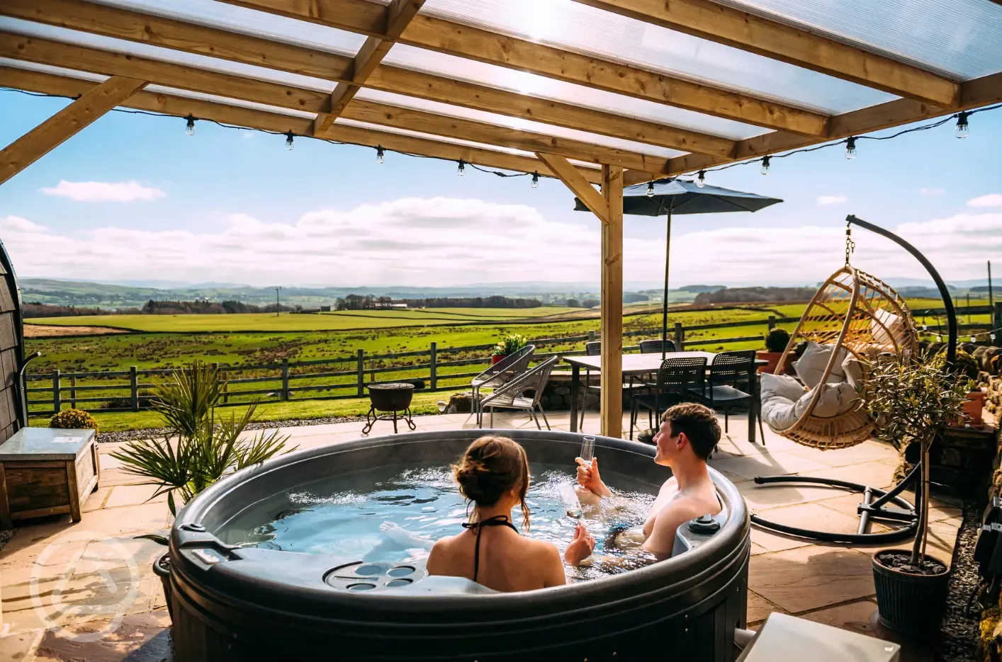 Private patios with hot tubs and cocoon swing chairs