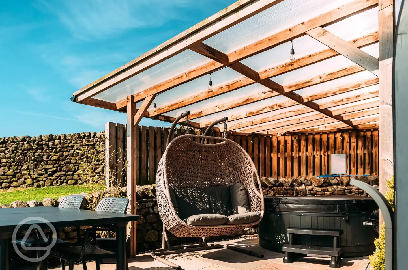 Private patios with hot tubs and cocoon swing chairs
