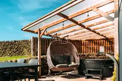 Private patios with hot tubs and cocoon swing chairs
