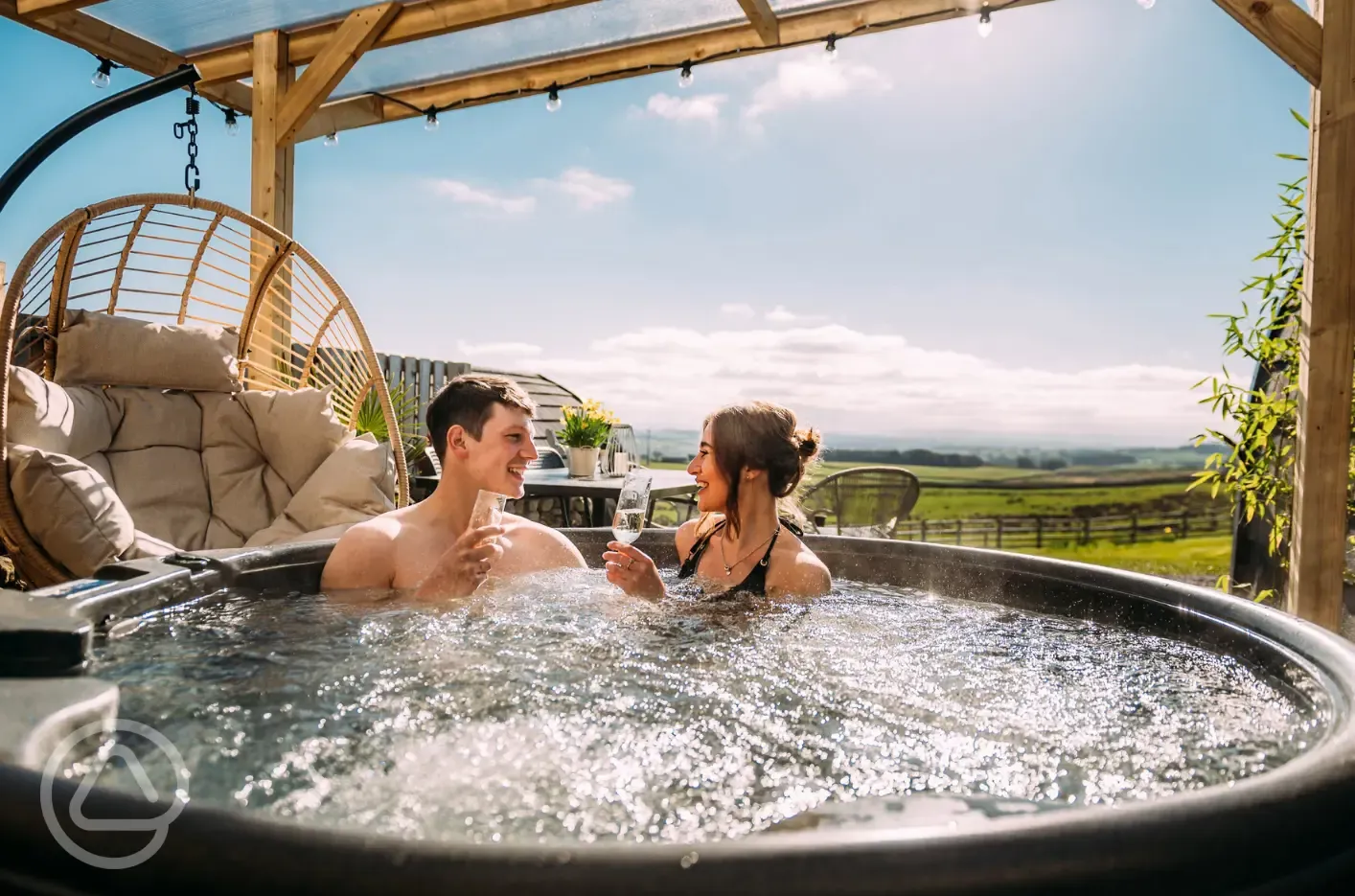 Private patios with hot tubs and cocoon swing chairs