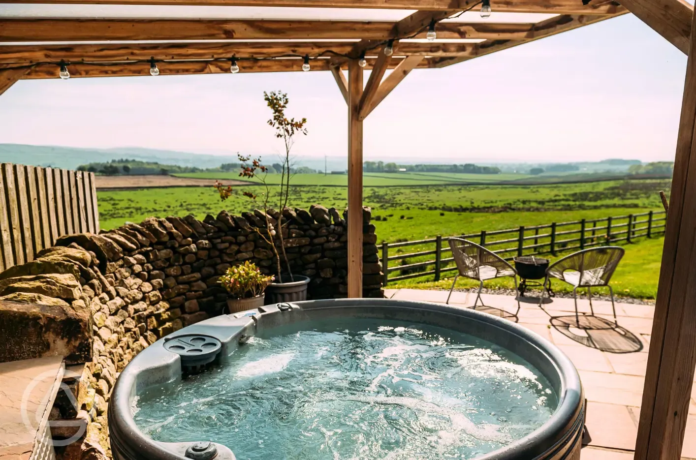 Private patios with hot tubs and cocoon swing chairs