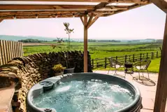 Private patios with hot tubs and cocoon swing chairs
