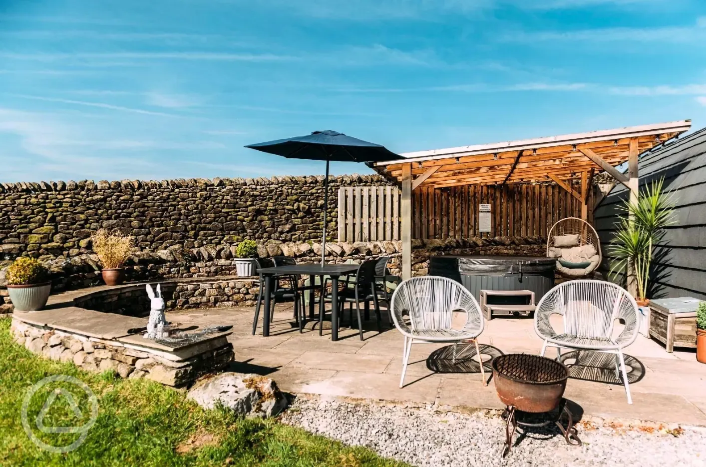 Private patios with hot tubs and cocoon swing chairs