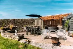 Private patios with hot tubs and cocoon swing chairs