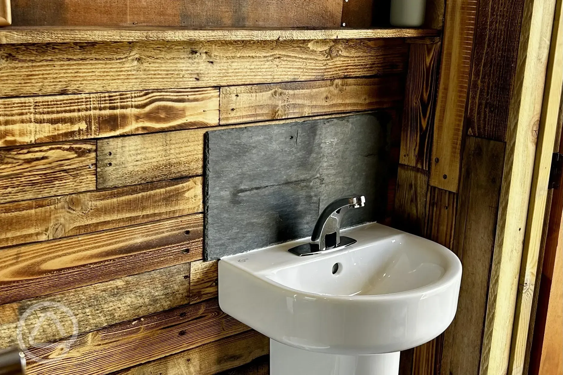Toilet and sink at Brambles Glamping