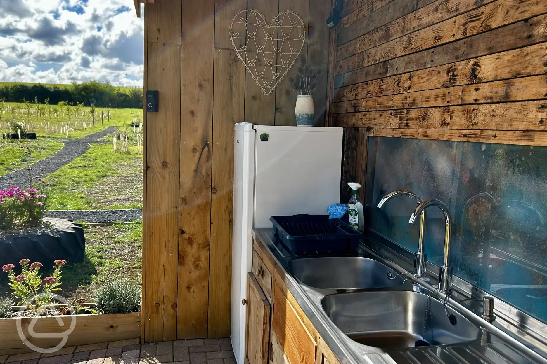 Washing up area at Brambles Glamping with communal fridge