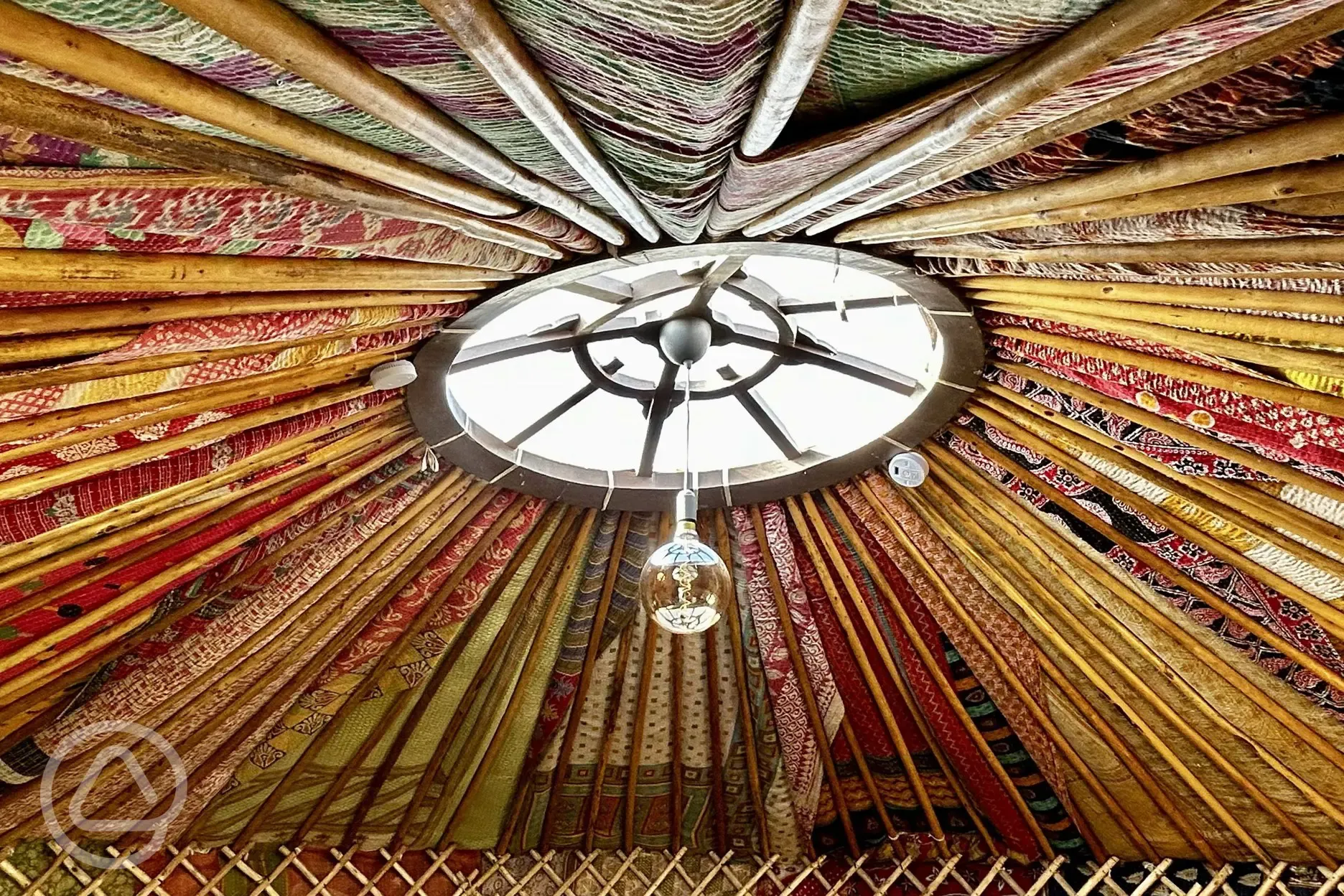 Indian fabrics covering the fully insulated interior of Primrose Yurt 