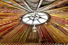 Indian fabrics covering the fully insulated interior of Primrose Yurt 