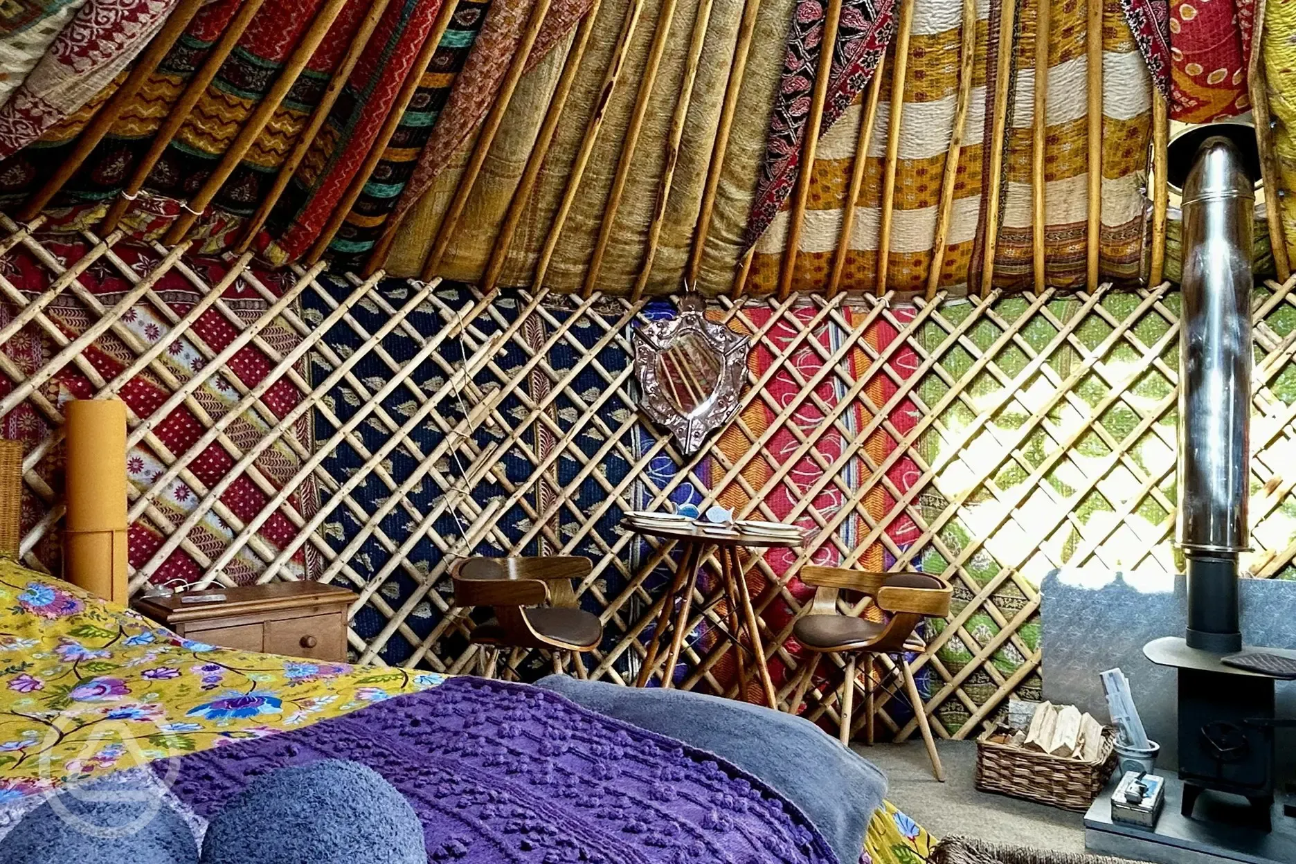 Primrose Yurt dining area and log burner