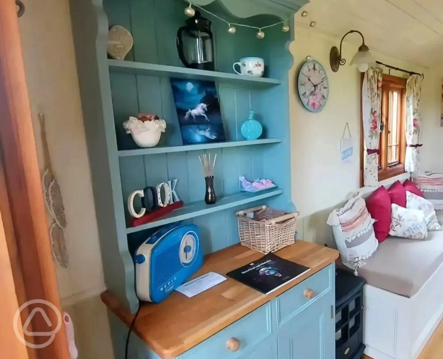 Shepherd's hut kitchen and seating area