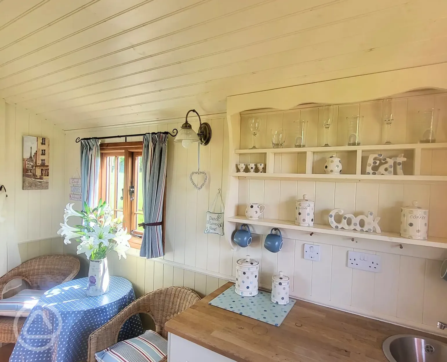 Shepherd's hut kitchen and seating area