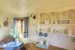 Shepherd's hut kitchen and seating area