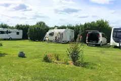 Grass and hardstanding touring pitches - optional electric Grass and hardstanding touring pitches - optional electric