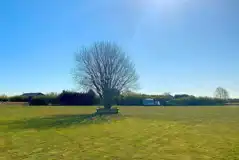 Grass and hardstanding touring pitches - optional electric Grass and hardstanding touring pitches - optional electric