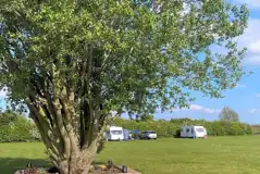 Grass and hardstanding touring pitches - optional electric Grass and hardstanding touring pitches - optional electric